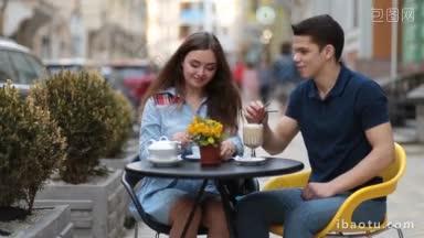 爱的情侣在路边咖啡馆放松，浪漫的约会，浪漫的情侣在咖啡店享受<strong>时光</strong>